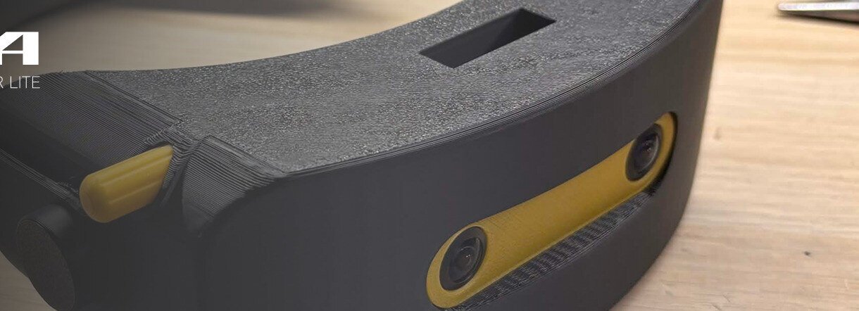 The Andromeda headset on a workbench, showing its yellow faceplate accents.